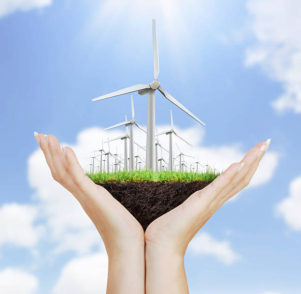 istock Wind turbine in the hand 621931256