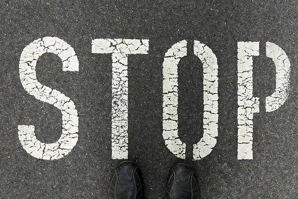 istock Word Stop written on an asphalt road 621934758