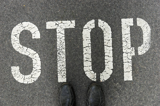 istock Word Stop written on an asphalt road 621934888