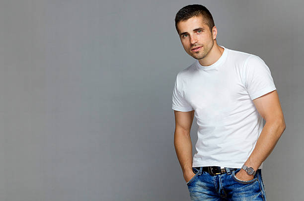 istock handsome man in a white T-shirt and jeans 621935092