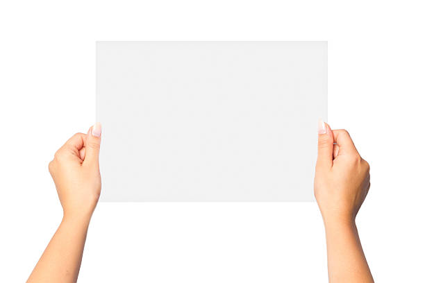 istock Women's hand holding a white sheet of paper 621935364