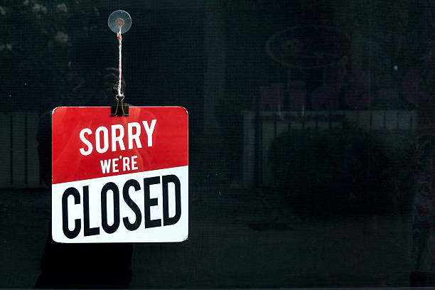 istock Closed sign in a shop window sorry we are closed 621935984
