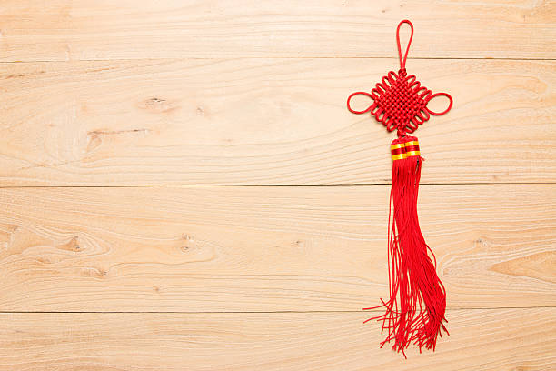 istock Chinese knot in the wood 621936374