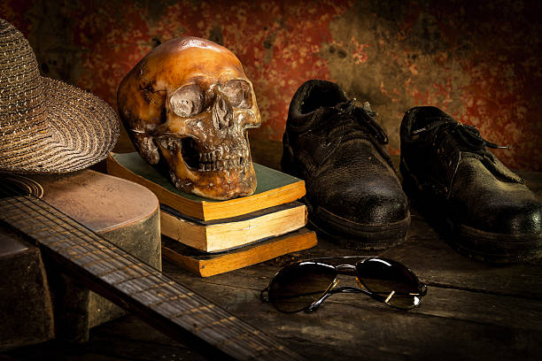Human Skull and old text book on old map Background