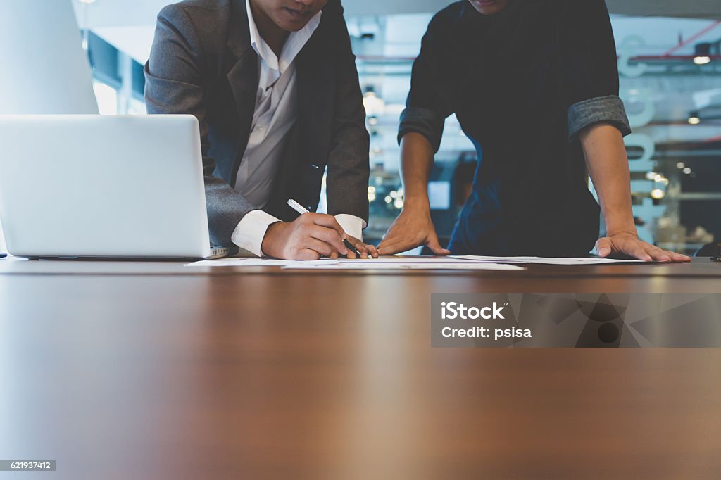 businessman working with document and computer in office workplace people working with document and laptop computer - meeting in office workplace concept Adult Stock Photo