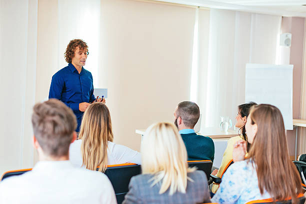 istock Moderator talking to participants on seminar 621939228