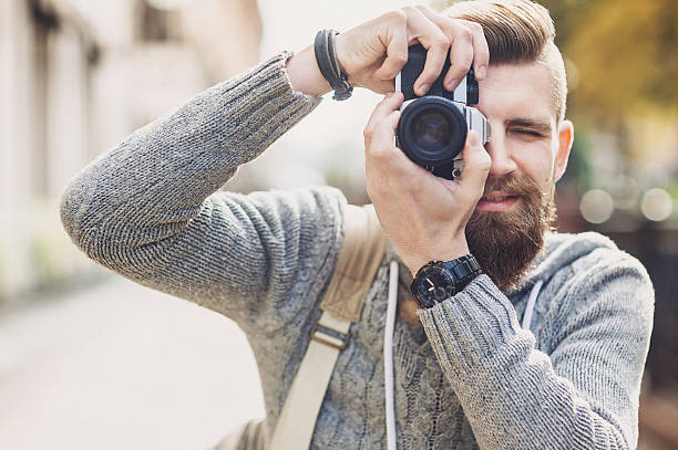 istock Young man photographer looking at camera 621973728