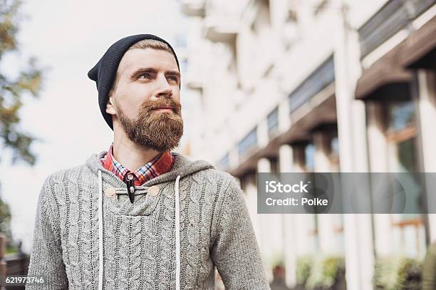 Cheerful Young Man Looking Up Stock Photo - Download Image Now - Men, Outdoors, Beard