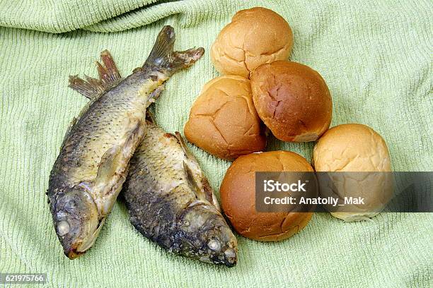 The Five Loaves And The Two Fishes Stock Photo - Download Image Now - Bible, Fish, Food