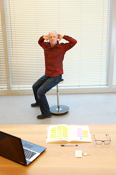istock middle age man stretching arms, relaxing neck 621976550