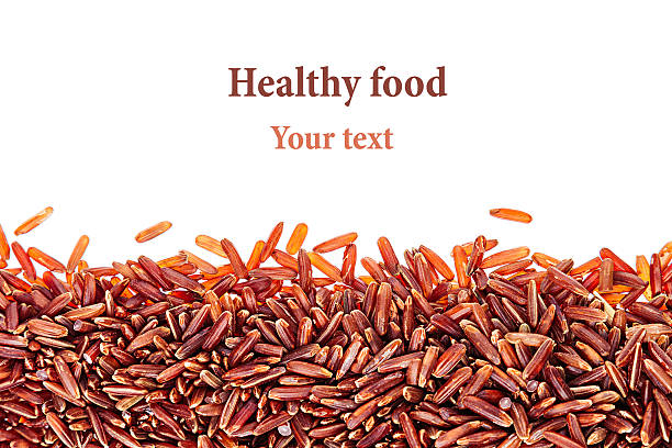 Red rice close-up border on white background. Border of red rice close-up  on white background. Isolated. Decorative frame of wild brown unpolished rice. genmai stock pictures, royalty-free photos & images