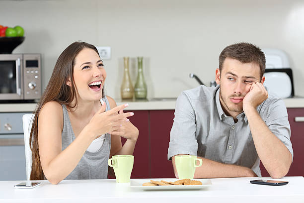 istock Bored husband hearing his wife talking 621979654