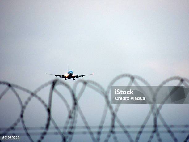 Airplane Landing At Manchester Airport Stock Photo - Download Image Now - Manchester International Airport, Airplane, Airport