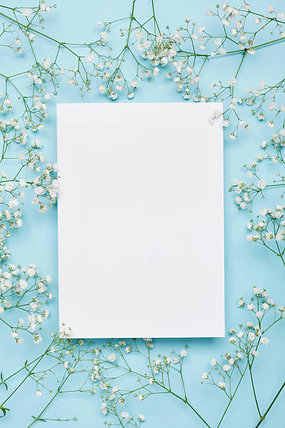 Wedding floral mockup with paper note, flowers gypsophila. Flat lay.