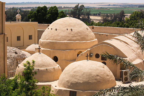 Wadi El Natrun, Egypt - July 20, 2016: A crucifix on a domed roof of the Monastery of Saint Bishoy, an ancient Coptic Orthodox Church in Wadi El Natrun. 