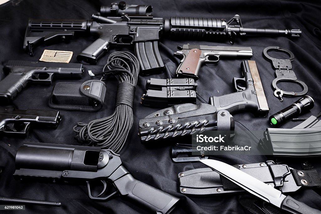 modern weapon on black background set of modern weapon on black textile background Ammunition Stock Photo