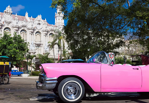 Beautiful american pink Cabriolet classic cars parked in Havana City Cuba