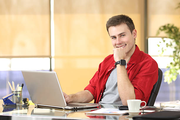 istock Entrepreneur working at office looking at you 621986376