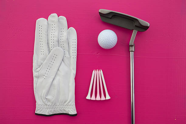Different golf equipments on the  desk Different golf equipments on the pink  desk - flat lay photography golf glove stock pictures, royalty-free photos & images