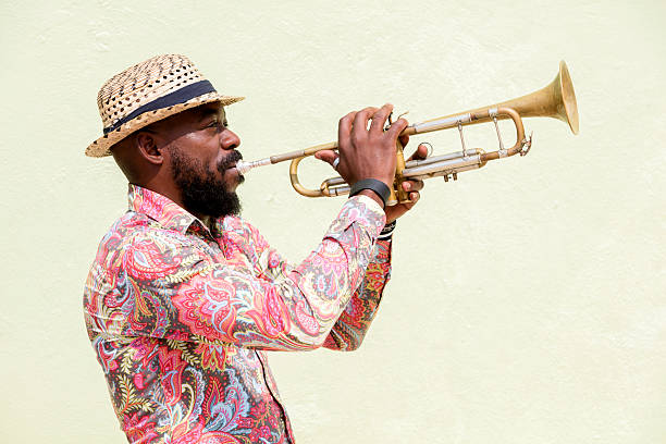 Cuban musician playing trumpet, Havana, Cuba Cuban musician playing a trumpet outdoors, Havana, Cuba cuban ethnicity stock pictures, royalty-free photos & images