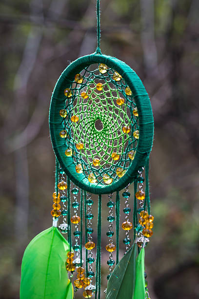 istock Dreamcatcher made of feathers, leather, beads, and ropes 621987202