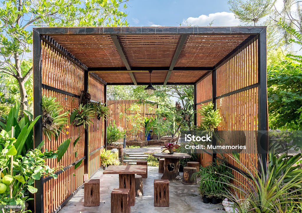 Architecture building wooden exterior in garden Architecture building wooden exterior in shady garden Wood - Material Stock Photo