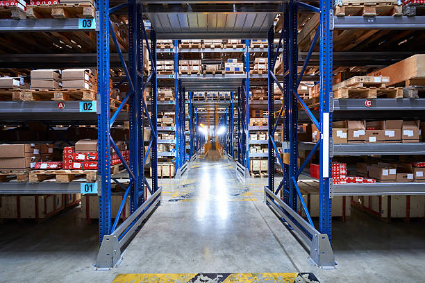 istock Front view of a man driving a forklift in aisle 621989274