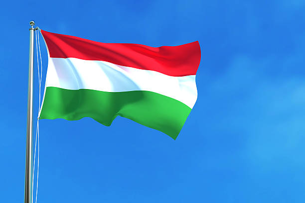 istock Flag of Hungary on the blue sky background. 621990968