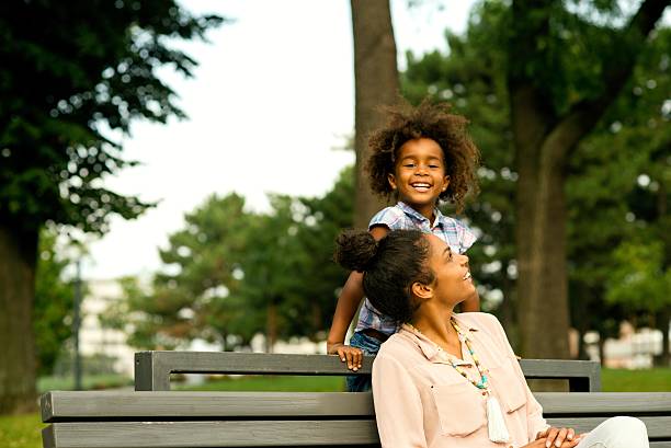 istock Mother and daughter having fun at the park. 621992244