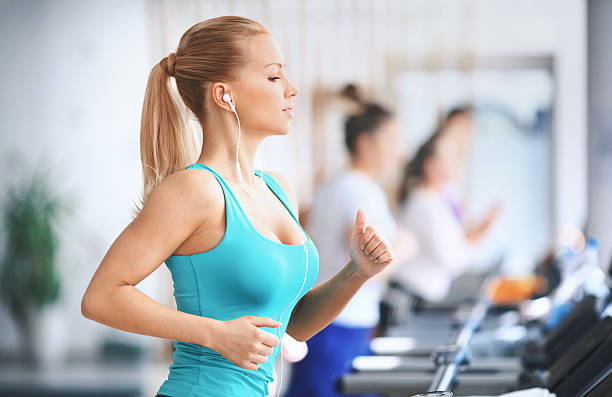 istock Woman exercising on a treadmill. 621993968