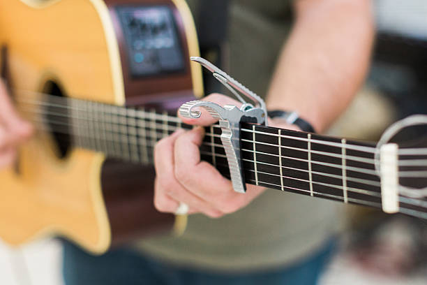 istock Man guitar player on acoustic guitar 621997336