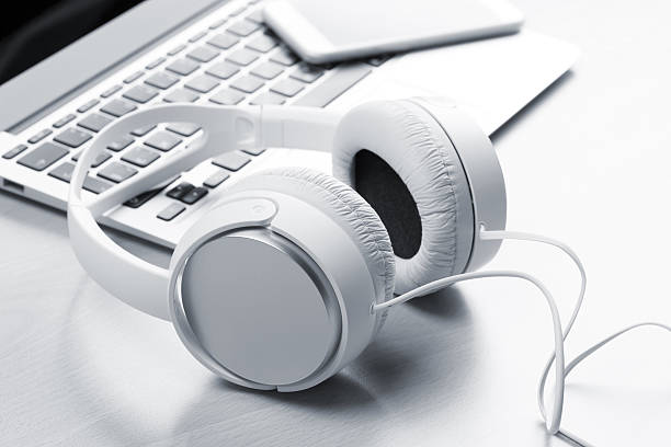 istock Headphones over laptop 621997388