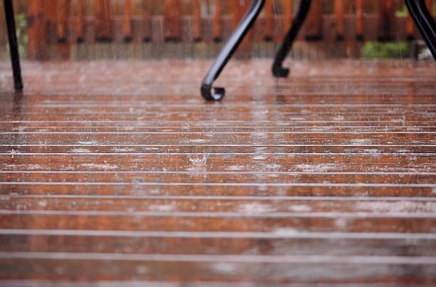 istock Patio/ deck floor in rainy day. Selective focus. 621997492