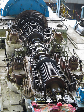 steam turbine in repair process, machinery, pipes, tubes, at an power plant