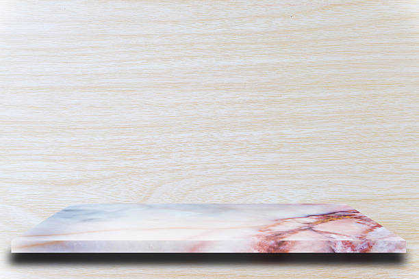 Empty top marble shelves and wooden wall background