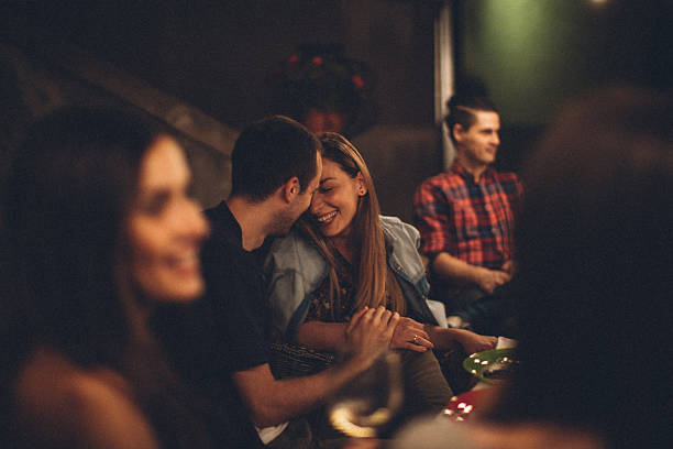 lovely couple at the party - dating restaurant dinner couple imagens e fotografias de stock