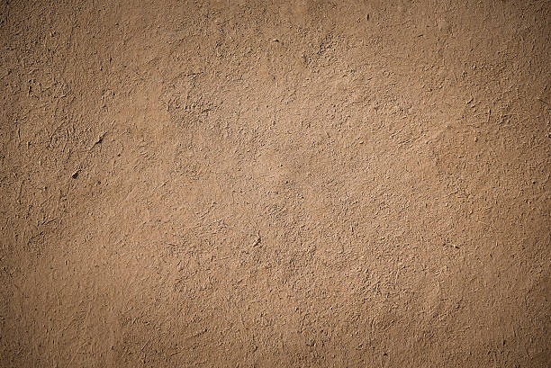 старая коричневая штукатурка глиняная стена - mud стоковые фото и изображения