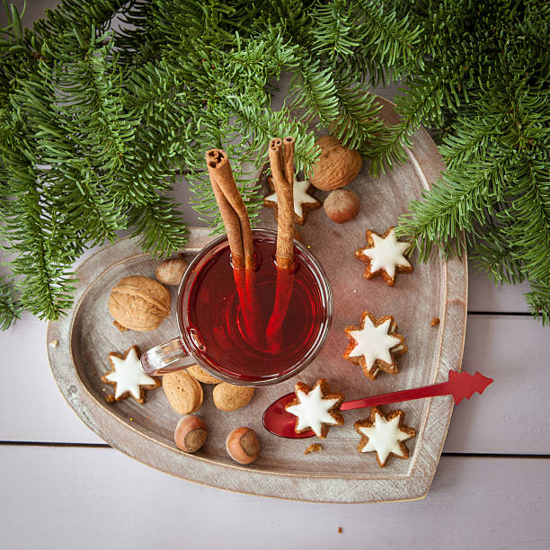 Mug of tea with christmas cookies