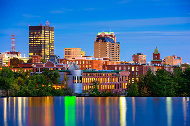Manchester, New Hampshire Skyline Manchester, New Hampshire, USA Skyline on the Merrimack River. new hampshire stock pictures, royalty-free photos & images