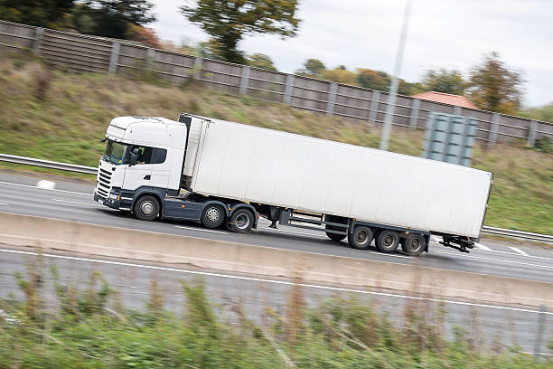 istock Road transport - White lorry  on the road 622005626