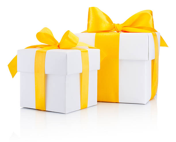 istock Two white gift boxs tied yellow satin ribbon bow Isolated 622008316