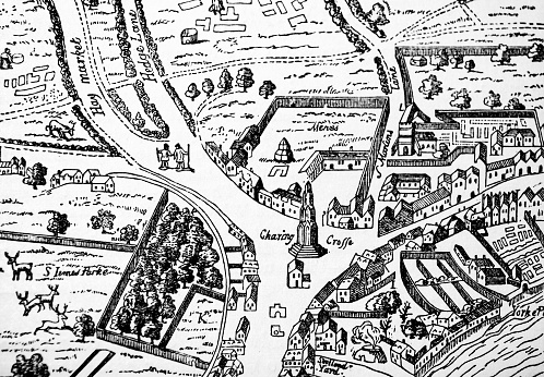 Property tax and costs on land for agricultural use - concept with an imaginary cadastral map and information placard