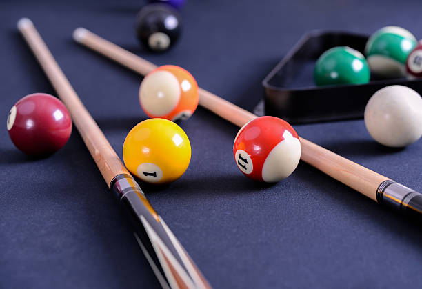 istock Blue billiard table with balls and cues. 622014636