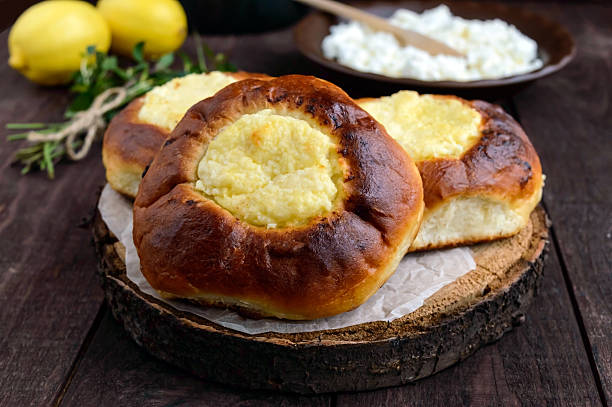 istock Vanilla cottage cheese buns (cheesecake) on dark wooden background. 622017126