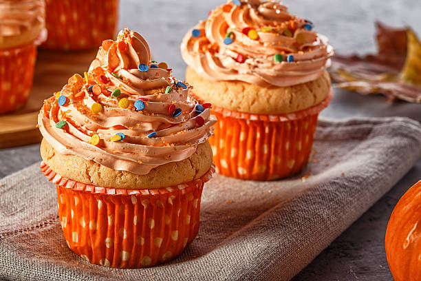 istock Pumpkin cupcakes with glitter sugar sprinkles. 622018242