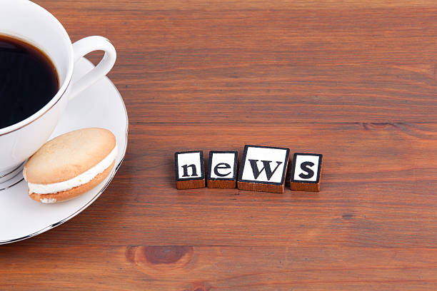 istock Coffee cup on a wooden table and text - News 622030844