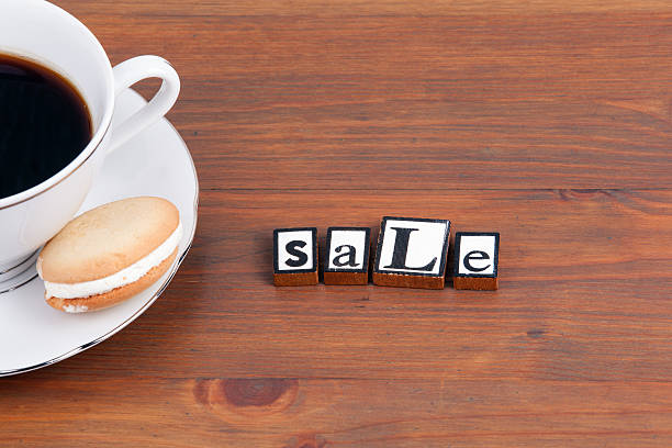 istock Coffee cup on a wooden table and text - Sale 622031720