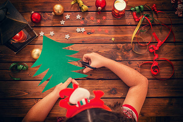 istock Little Girl Making Christmas Card 622032726