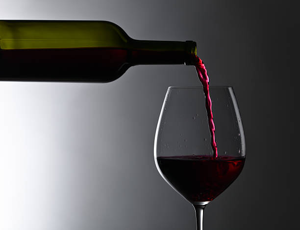 istock bottle and glass of red wine 622032858
