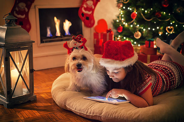 istock Beautiful little girl using digital tablet on Christmas night 622033458